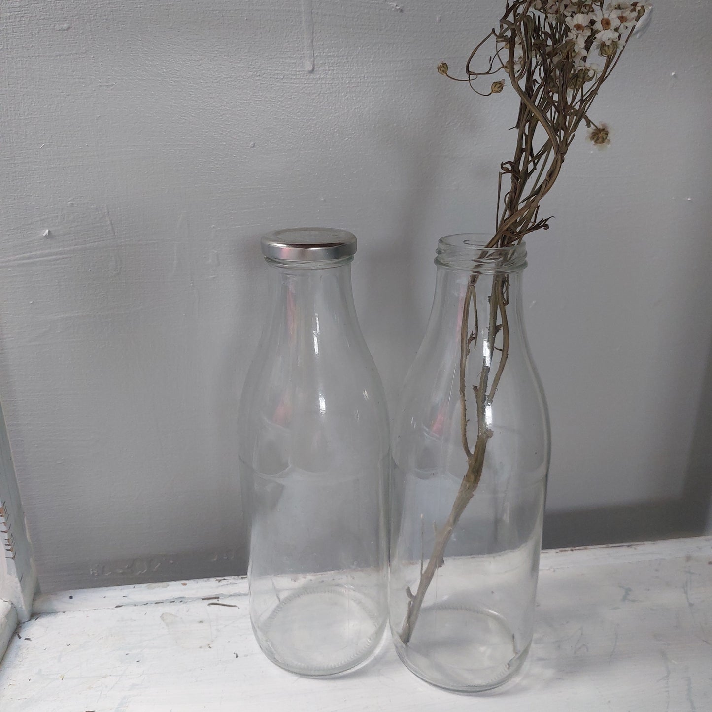 Duo of large milk bottles